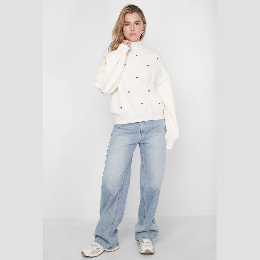 Gebreide trui met hartjes