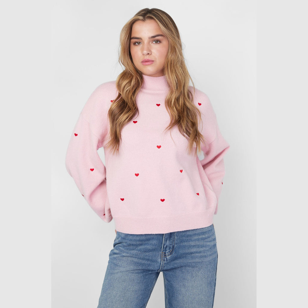Gebreide trui met hartjes