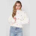 Gebreide trui met hartjes