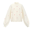 Gebreide trui met hartjes