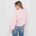 Gebreide trui met hartjes